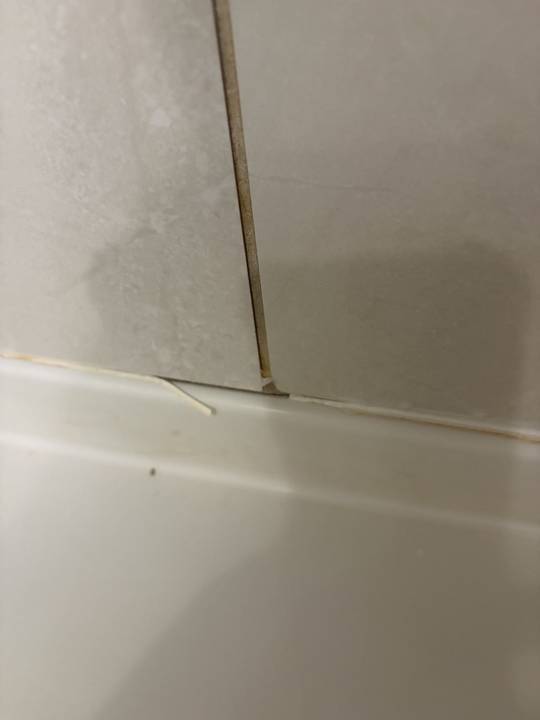Tub re-caulk, before
