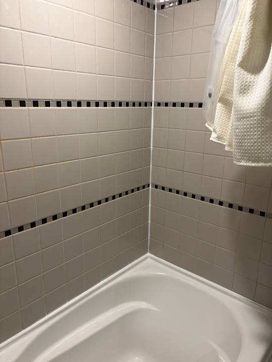 Shower corner caulking