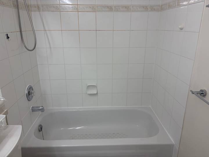 Mouldy caulk replaced, after